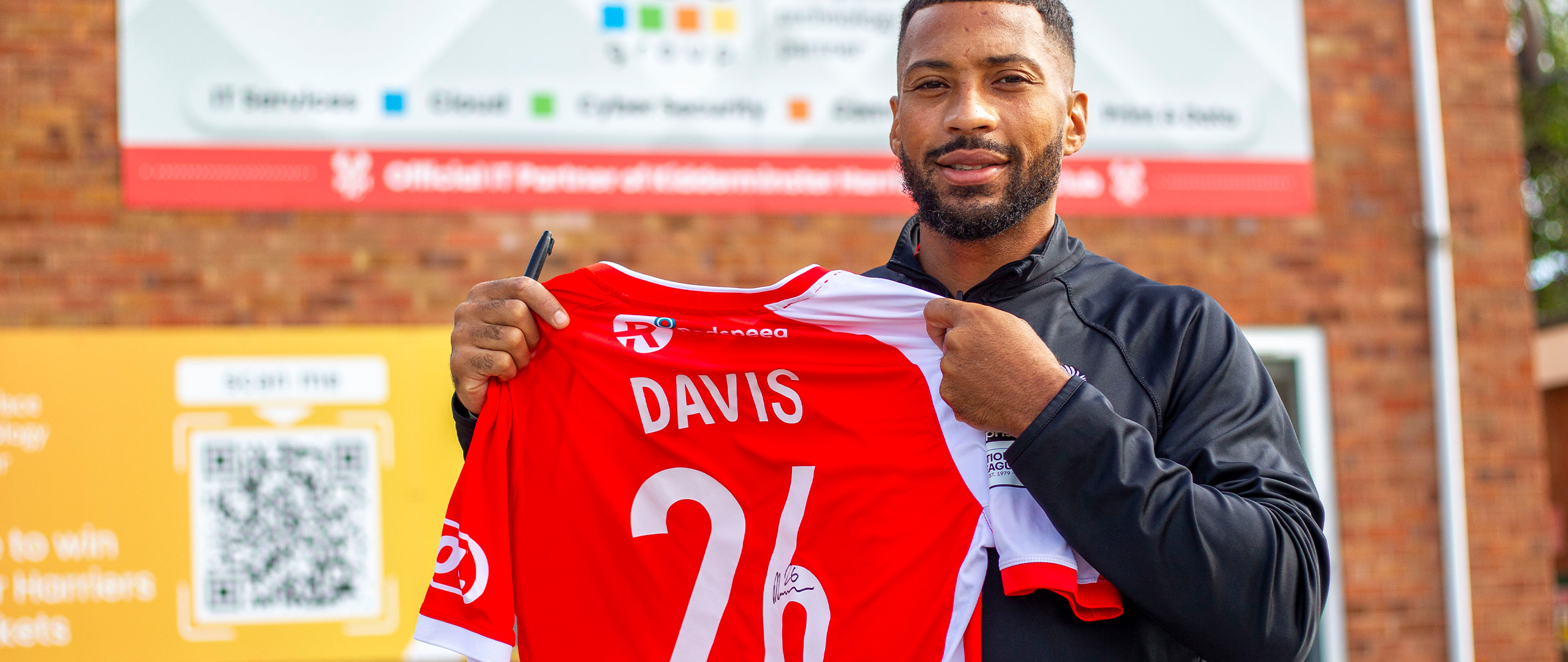 Bid on a signed match-worn David Davis shirt!