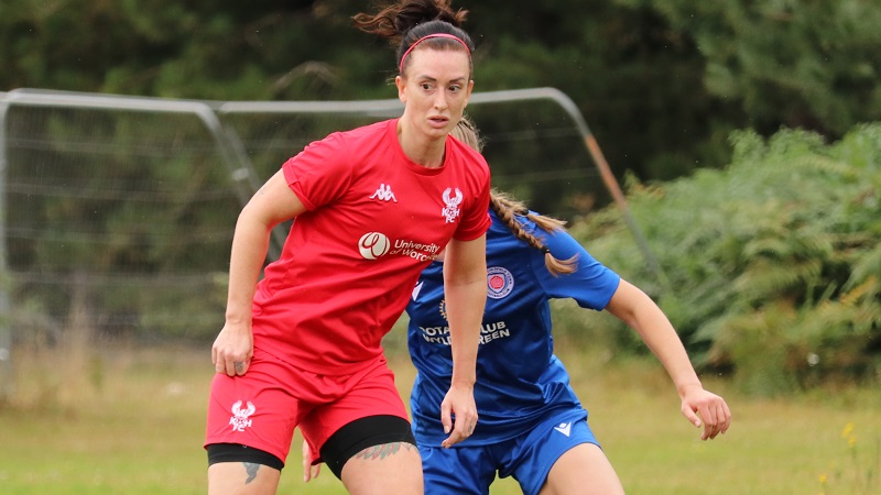 Women romp to first League win